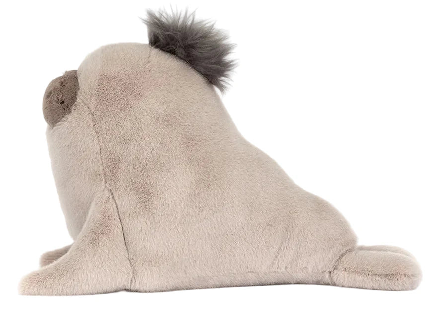 Jellycat’s Roarwell Sea Lion plush toy features a light gray body, darker round snout, and a short gray tuft on its head, depicted as if pausing mid-dance when viewed from the side.