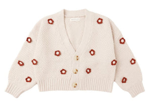 Cozy and cream-colored, the Rylee & Cru Baby Girls' and Girls' Boxy Crop Cardigan features a textured knit, V-neck, three buttons, bubbled sleeves, and scattered red floral patterns.