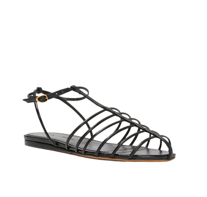 The Proenza Schouler Tee Cage Flat Sandals boast a chic black caged design with t-crossed straps, a flat sole, and a stylish ankle buckle for added flair.