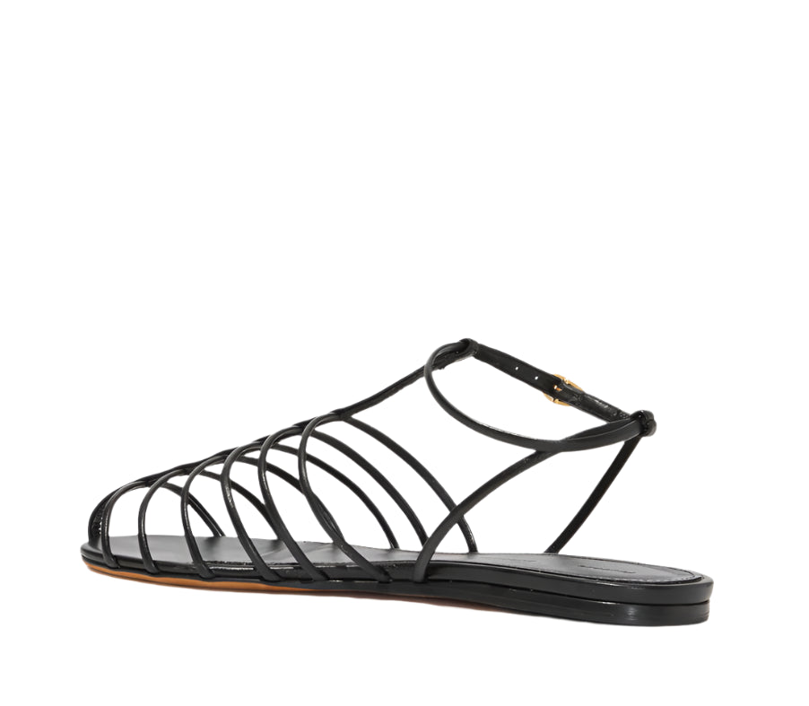 Proenza Schouler Tee Cage Flat Sandals feature a sleek caged design with t-crossed straps and a thin sole, shown from the side on a white background.