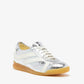 The Proenza Schouler Track Crinkled Metallic Sneakers feature silver leather, white side stripes and laces, a tan rubber sole, and a memory foam insole, shown on a plain white background.