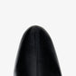 Top view of the toe section of the Proenza Schouler Uma Ankle Boots in black leather, featuring a central stitched seam, against a plain white background.
