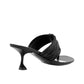 The Proenza Schouler Cable T Strap Sandals are black heeled sandals with a sculpted heel and woven straps, plus a gathered top strap, shown from the back and side on a white background.