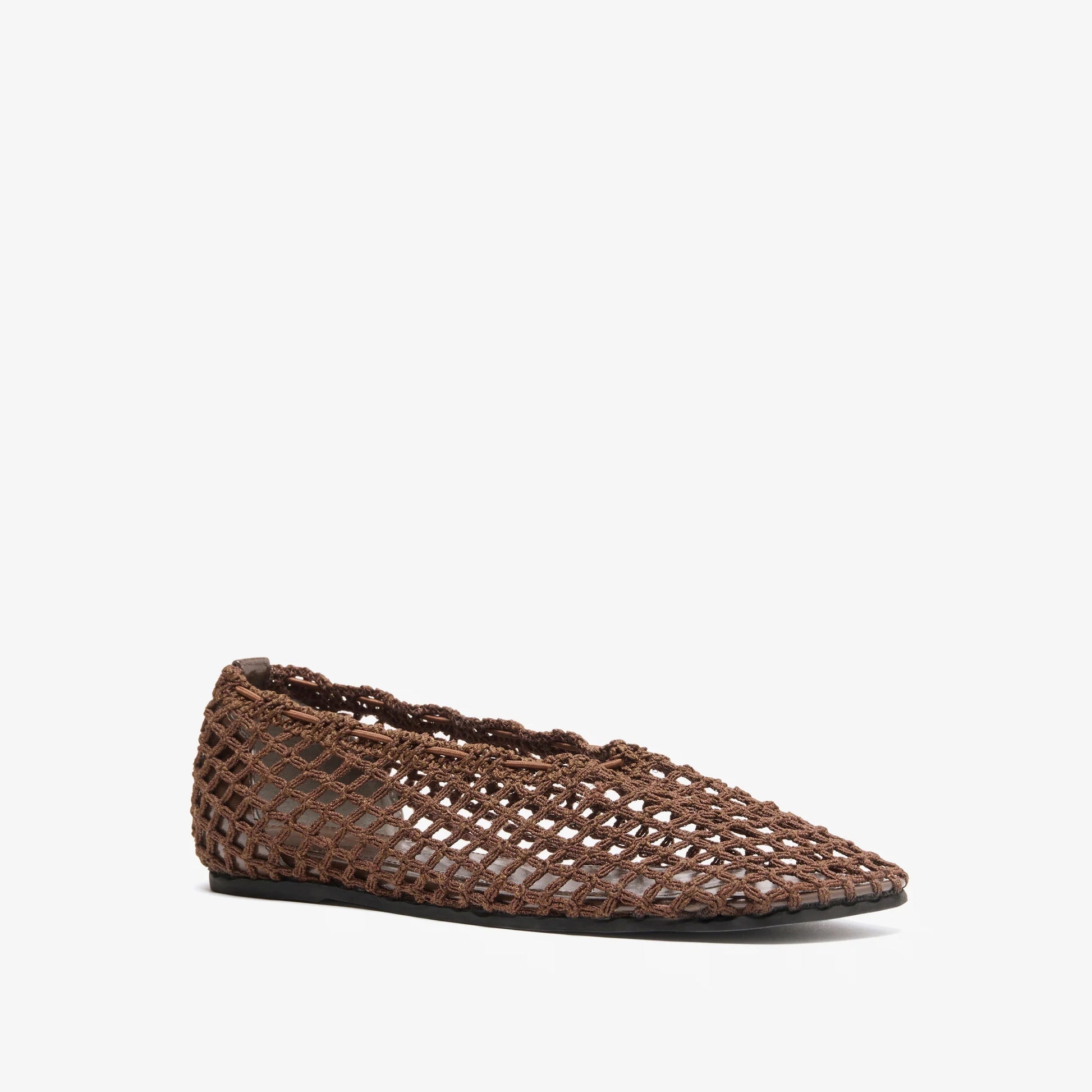 The Proenza Schouler Slant Crochet Flat is a brown slip-on shoe with a pointed toe and open mesh design, shown on a white background.