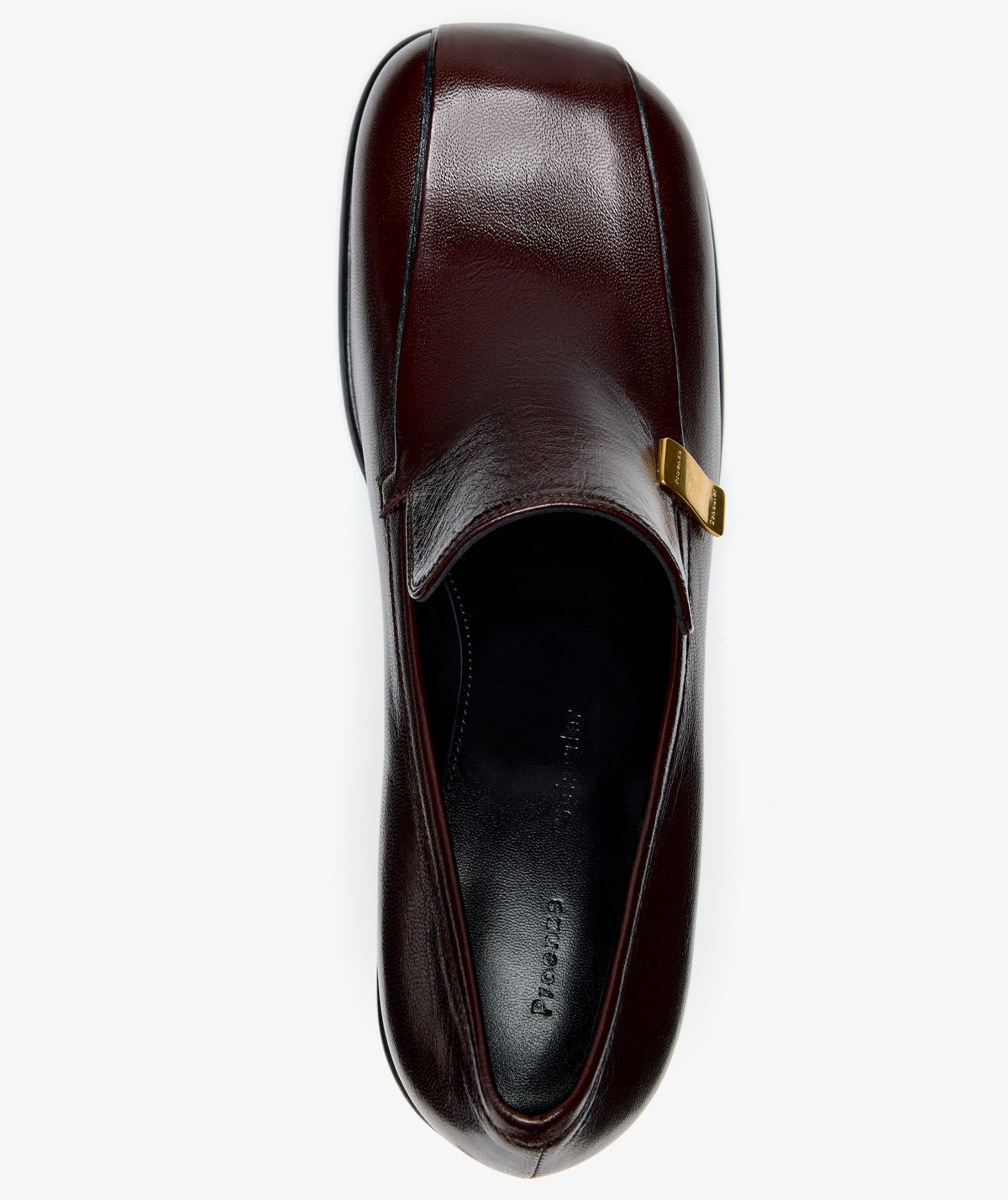 Top-down view of a dark brown Nappa Latex Proenza Schouler Esme Loafer with a square toe and a small gold metal plaque on the side.