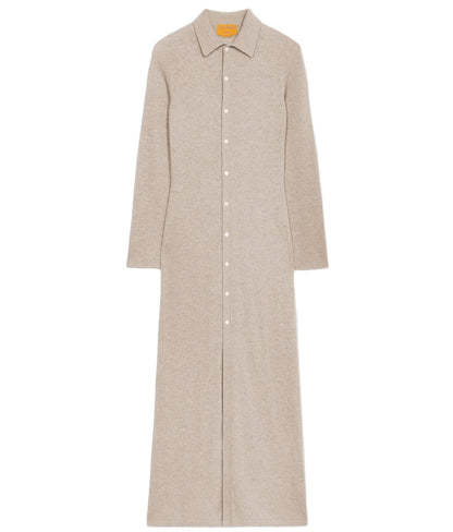 The Showtime Cashmere Shirt Dress by Guest in Residence is a lightweight, beige long-sleeve collared shirt dress with a button-down front, shown laid flat on a white background.