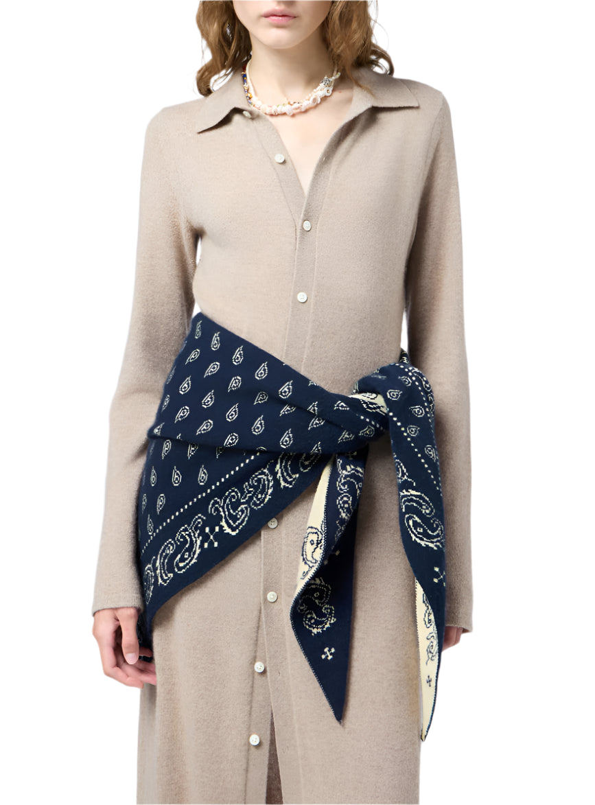 A woman wears the Showtime Cashmere Shirt Dress by Guest in Residence, styled with a navy paisley bandana at the waist and a pearl necklace.