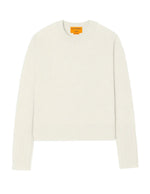 Guest in Residence's Shrunken Crew Cashmere Sweater is a white slim-fit long-sleeve knit with a round neckline and features a visible orange label on the inside collar.