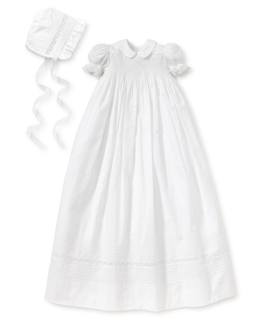 A white Kissy Kissy Silene Christening Gown & Hat Set with smocking.