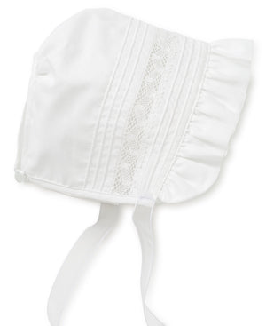 A white bonnet with smocking and lace trim from the Kissy Kissy Silene Christening Gown & Hat Set.