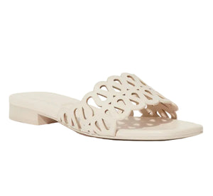 The Simkhai McCall Laser Cut Flat Slide is a supple leather sandal with an open toe and a wide off-white strap, featuring laser perforations and a chic cutout pattern.