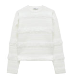 The Simkhai Carrick Crewneck Sweater is a white knit long-sleeve top featuring horizontal stripes and textured fringe accents on the front and sleeves, shown against a plain background.