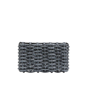 The Simkhai Morgan Clutch, a rectangular woven purse adorned with a metallic gray beaded design that echoes Simkhai’s elegant aesthetic, is displayed against a plain white background.