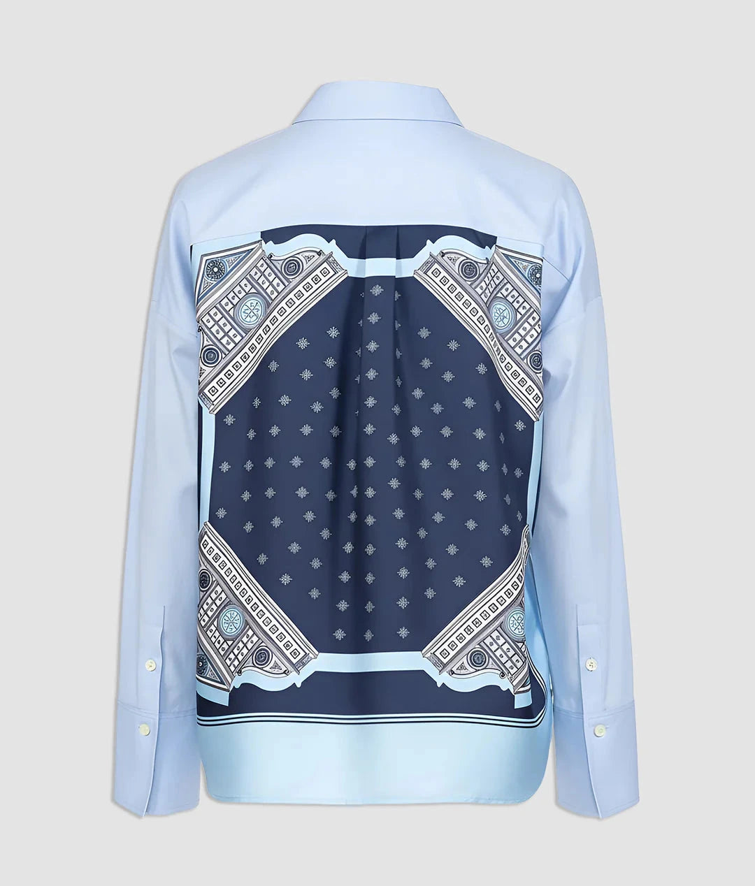 The Sirene Top by Callas Milano is a light blue cotton poplin shirt with a navy and white geometric patterned back, showcasing refined Italian craftsmanship.
