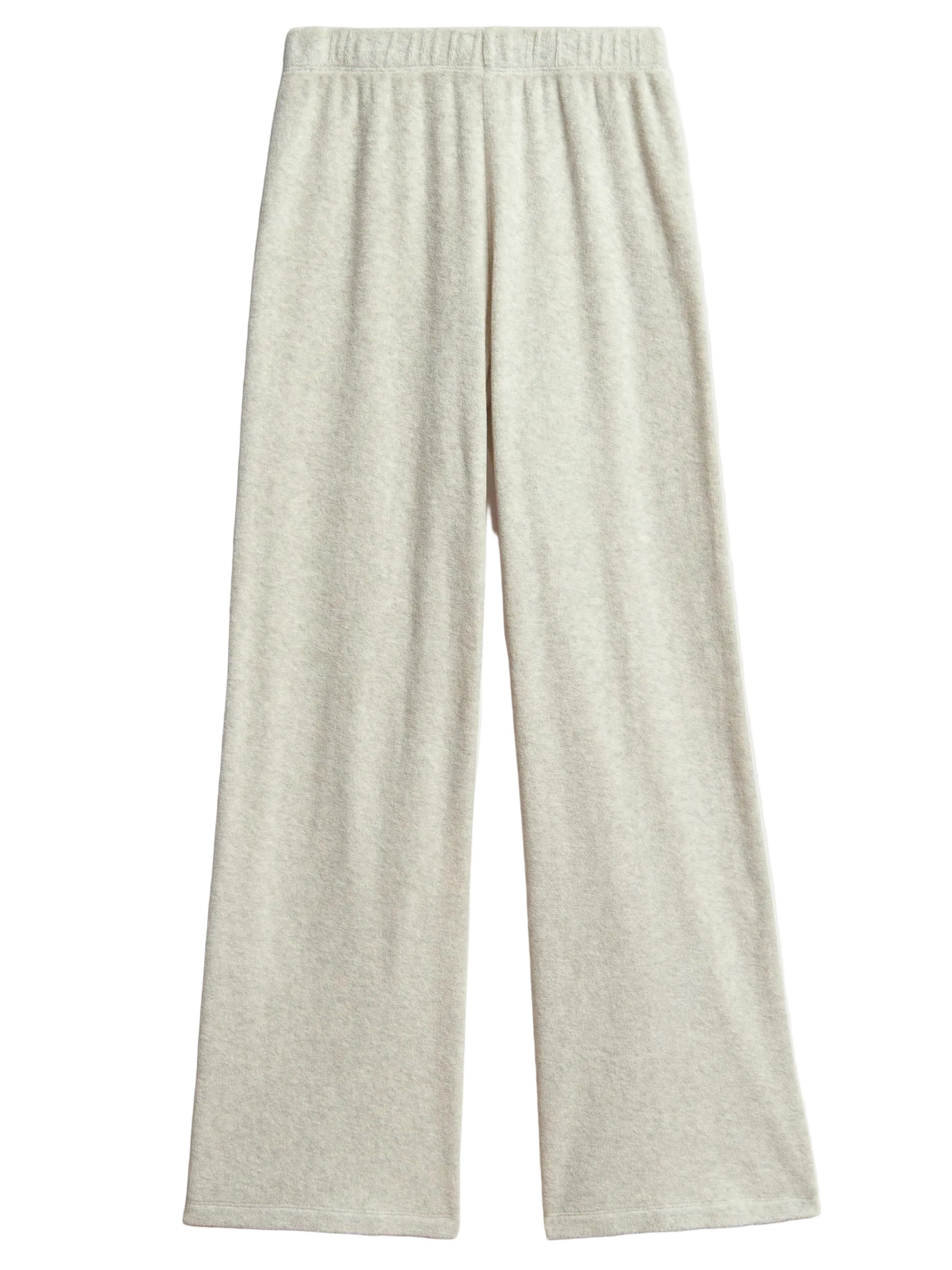 The Suzie Kondi Zephyra Flare Pants are light gray, high-waisted wide leg pants with an elastic waistband, made from soft terry toweling and shown on a flat white background.