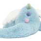 The Jellycat Sky Dragon is a light blue plush with a long tail, white wings, pastel pom-poms on its back, and a green tuft—ideal for midnight storytelling or as a cozy companion for camping adventures.