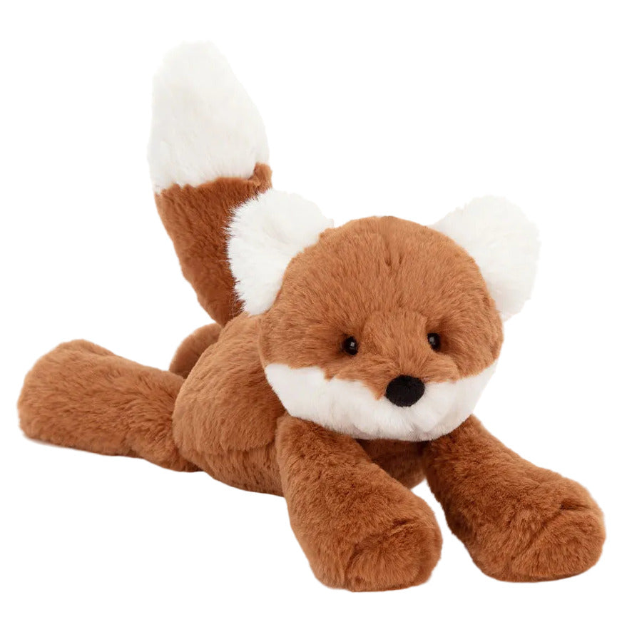 Jellycat’s Smudge Fox is a plush toy with brown fur, a white-tipped tail, white ears, and a white snout, lying flat on its belly.