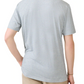 A person is seen from behind wearing Faherty's Short-Sleeve Movement™ Polo Shirt in light blue and white stripes with beige pants, hand resting on hip. This polo combines effortless movement with comfort and style.