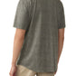 A man is seen from the back in a Faherty Short-Sleeve Hermosa Shirt, featuring a travel-inspired pattern on Supima cotton, paired with beige pants.