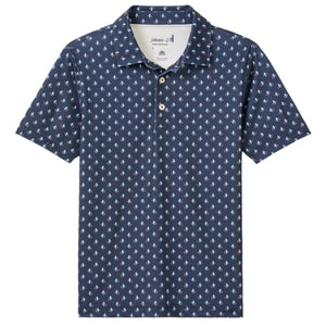 The Johnnie-O Boys' Performance Jersey Jr. Polo - For The Birdies Print is a cool, comfortable navy blue shirt with a white palm tree pattern, classic collar, three buttons, and lightweight fabric for all-day wear.