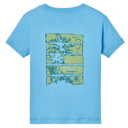 The Johnnie-O Boys Jr. Pocket T-Shirt is a light blue faded short-sleeve tee with a palm trees and birds graphic plus "PARADISE SOUTH AMERICA" text on the back, perfect for all-day comfort.