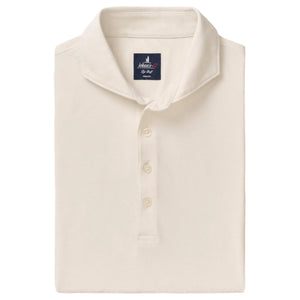 The Idris Polo by Johnnie-O is a folded, off-white collared shirt with three buttons and a visible brand label inside the collar, crafted from lightweight fabric for all-day comfort.
