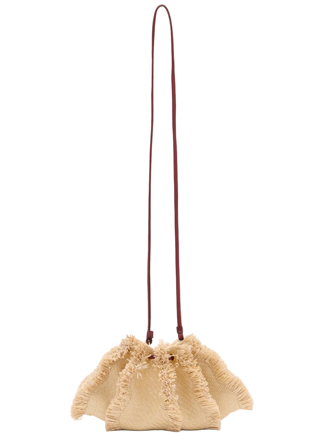 The Ulla Johnson Adria Small Crossbody, a beige raffia bag with textured fringe edges and a slim brown shoulder strap, is shown against a white background.