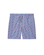 The Johnnie-O Freesia Swim Trunk features an all-over red and white geometric pattern on blue fabric, a front drawstring, and a comfortable 7" inseam, shown against a white background.