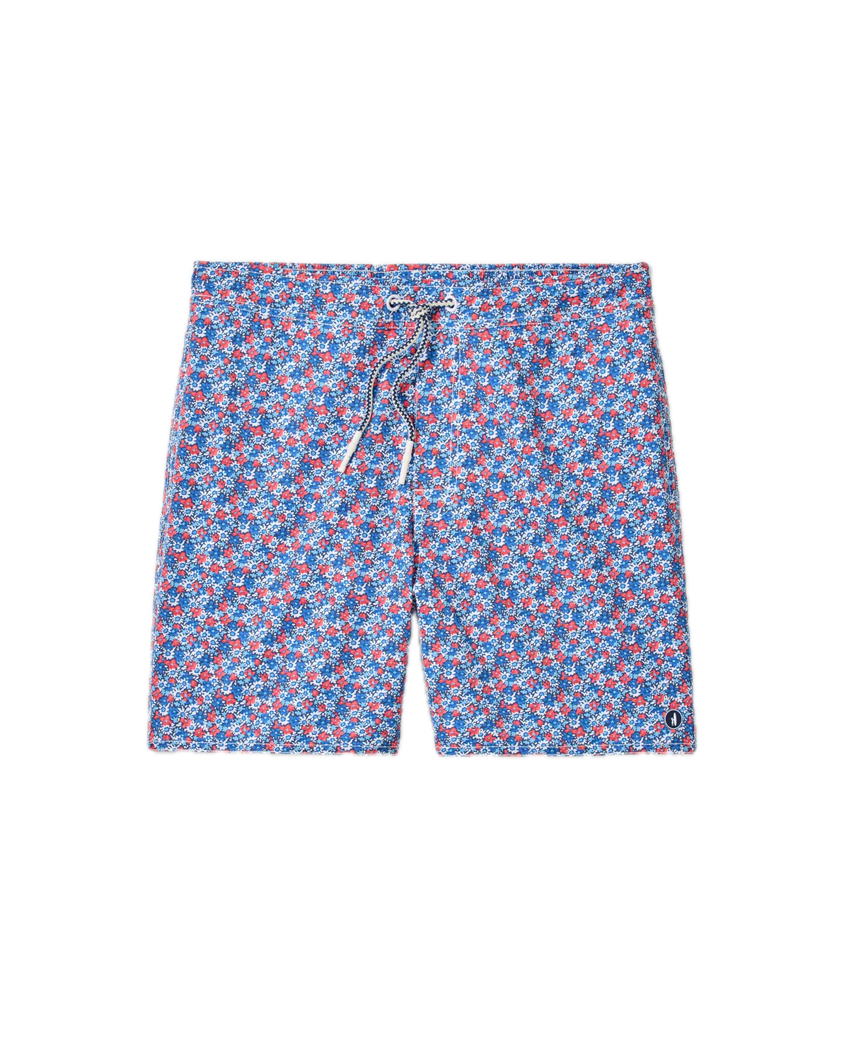 The Johnnie-O Freesia Swim Trunk features an all-over red and white geometric pattern on blue fabric, a front drawstring, and a comfortable 7" inseam, shown against a white background.