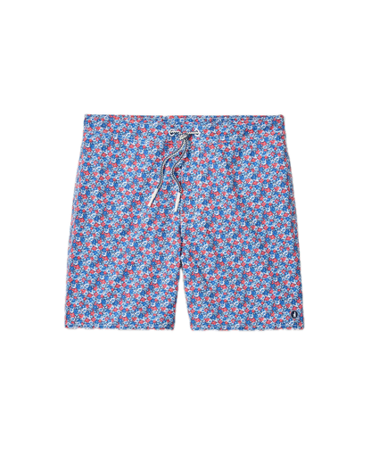The Johnnie-O Freesia Swim Trunk features an all-over red and white geometric pattern on blue fabric, a front drawstring, and a comfortable 7" inseam, shown against a white background.