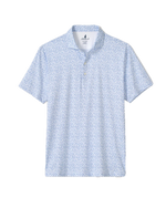The Johnnie-O Marietta Polo is a light blue, short-sleeve featherweight shirt with a subtle small floral print, featuring a buttoned neckline and a classic collar. Displayed on a white background, this stylish piece combines the lightweight comfort of modern design with the timeless appeal of classic performance polos.
