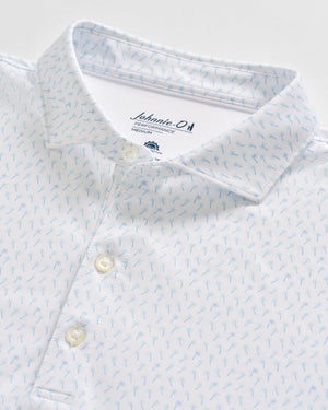 Close-up of a white Johnnie-O Marina Polo with a light blue small pattern and buttons, made from moisture-wicking fabric and featuring the brand label inside the collar.