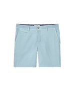 The Nassau Shorts by Johnnie-O are men’s Bermuda-style shorts in light blue, crafted from lightweight fabric. They feature belt loops, a button closure, two side pockets, and a small welt pocket on the right side. These shorts are displayed against a white background.