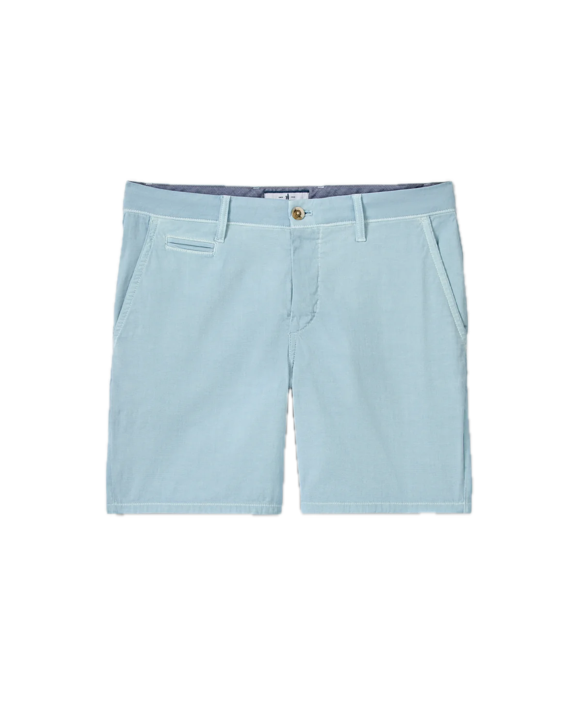 The Nassau Shorts by Johnnie-O are men’s Bermuda-style shorts in light blue, crafted from lightweight fabric. They feature belt loops, a button closure, two side pockets, and a small welt pocket on the right side. These shorts are displayed against a white background.