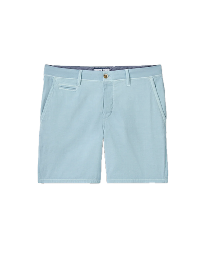 The Nassau Shorts by Johnnie-O are men’s Bermuda-style shorts in light blue, crafted from lightweight fabric. They feature belt loops, a button closure, two side pockets, and a small welt pocket on the right side. These shorts are displayed against a white background.
