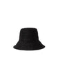 The Felix Hat by Janessa Leone, a black woven bucket hat ideal for summer, is shown against a white background.