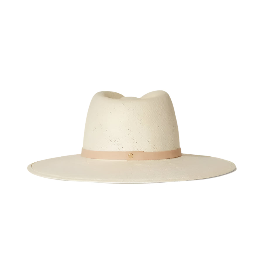 The Sherman Hat by Janessa Leone is a wide-brimmed, off-white packable straw fedora with a beige band and gold accent, shown on a white background.