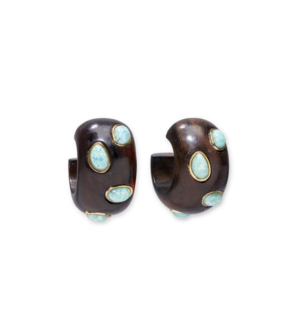 The Acacia Earrings by Lizzie Fortunato feature dark brown sandalwood hoops with turquoise and amazonite stones set in gold bezels, displayed against a white background.