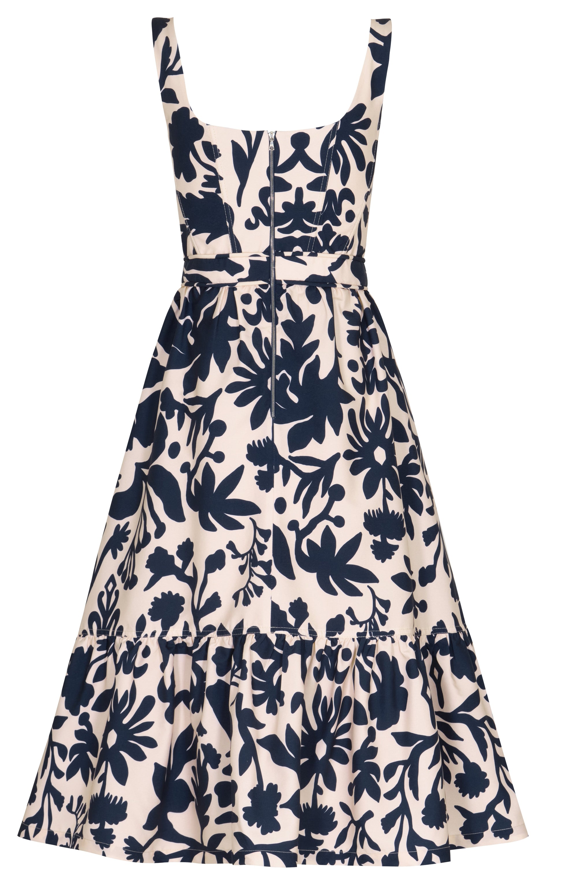 The Encanto Midi Dress by Andres Otalora is a sleeveless design with a bold white and blue print. It features a classic feminine silhouette with a fitted bodice, flared skirt, and navy floral pattern for an effortlessly chic knee-length look.
