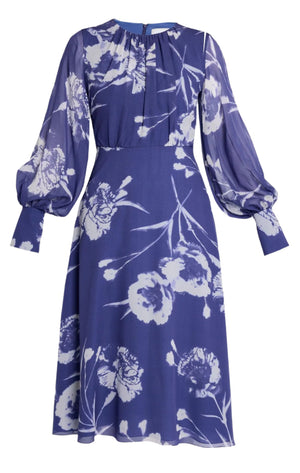 The Erdem Long Sleeve Midi Dress is a silk voile piece in heather, featuring a delicate white floral pattern, sheer puffed sleeves, and a knee-length skirt.