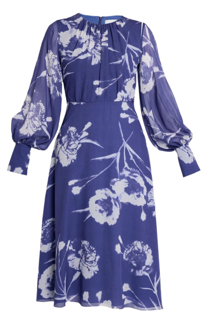 The Erdem Long Sleeve Midi Dress is a silk voile piece in heather, featuring a delicate white floral pattern, sheer puffed sleeves, and a knee-length skirt.