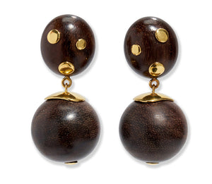 The Lizzie Fortunato Nopales Earrings are lightweight earrings featuring dark brown wood beads with gold-plated brass accents, gold-dotted ovals on top, and round beads below capped in gold.