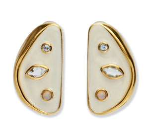 The Isola Stud Earrings by Lizzie Fortunato are asymmetrical gold-plated brass earrings with cream enamel, featuring round, marquise, and opal-like stones, shown against a white background.