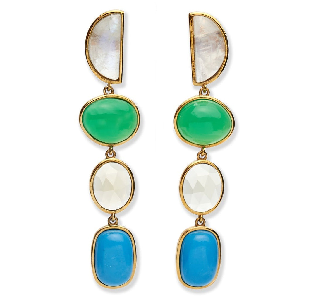 The Cala Drop Earrings by Lizzie Fortunato showcase statement gold-plated brass frames adorned with a half-moon moonstone, green oval stone, faceted white oval stone, and blue rectangular stone.