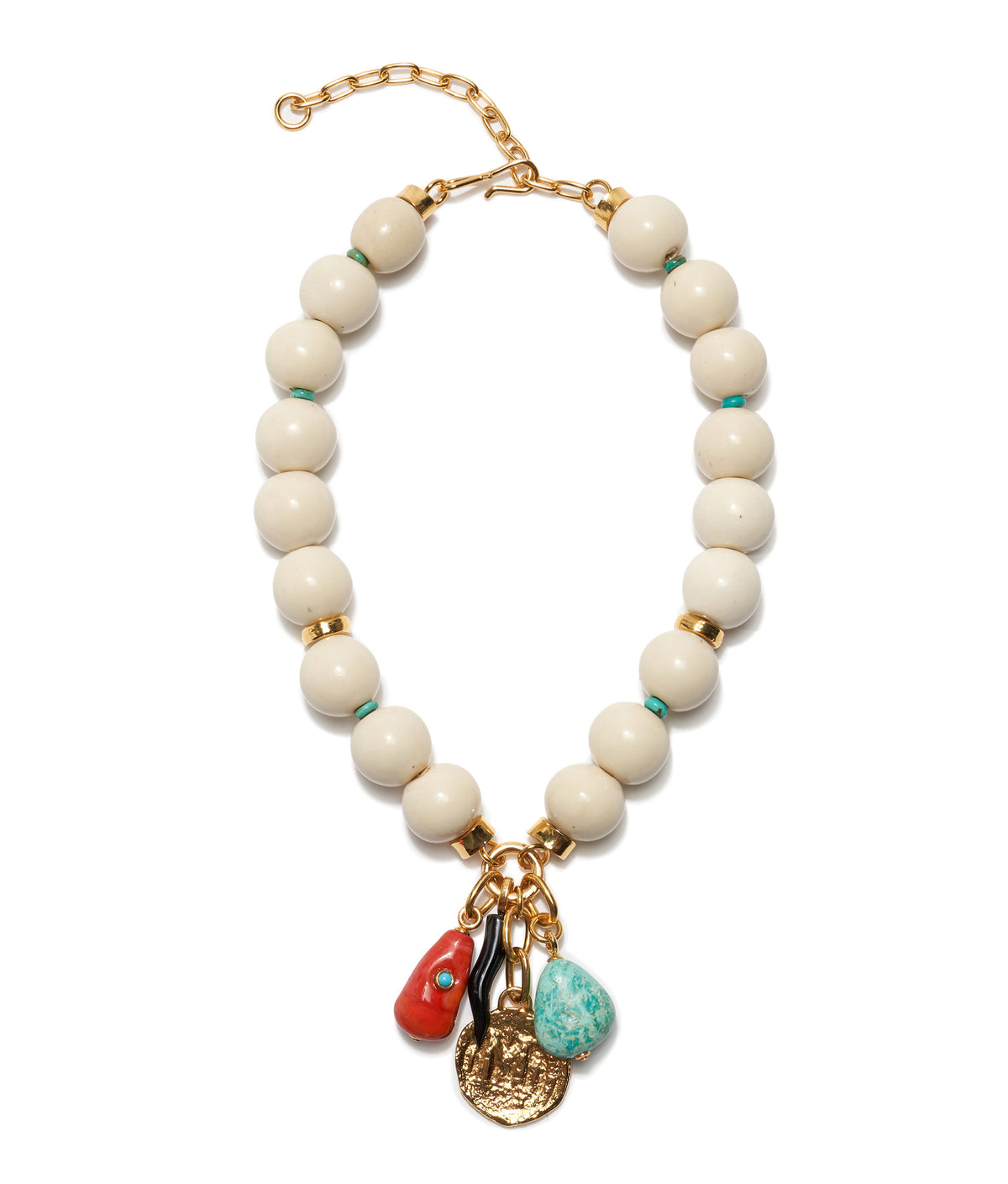 The Blanca Necklace by Lizzie Fortunato features large cream acrylic beads, gold-plated accents, and three hanging charms: a red bead, turquoise stone, and gold coin-like pendant.