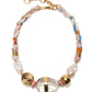 The Glass Beach Necklace by Lizzie Fortunato features multicolored fabric, gold-tone hardware, clear and gold beads, and two irregular freshwater pearls.