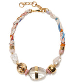 The Glass Beach Necklace by Lizzie Fortunato features multicolored fabric, gold-tone hardware, clear and gold beads, and two irregular freshwater pearls.