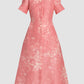 The Erdem Rose Bouquet Linen Chine Midi Shirt Dress features rose-pink linen, short sleeves, a collared neckline, button-down front, and a subtle white floral pattern.