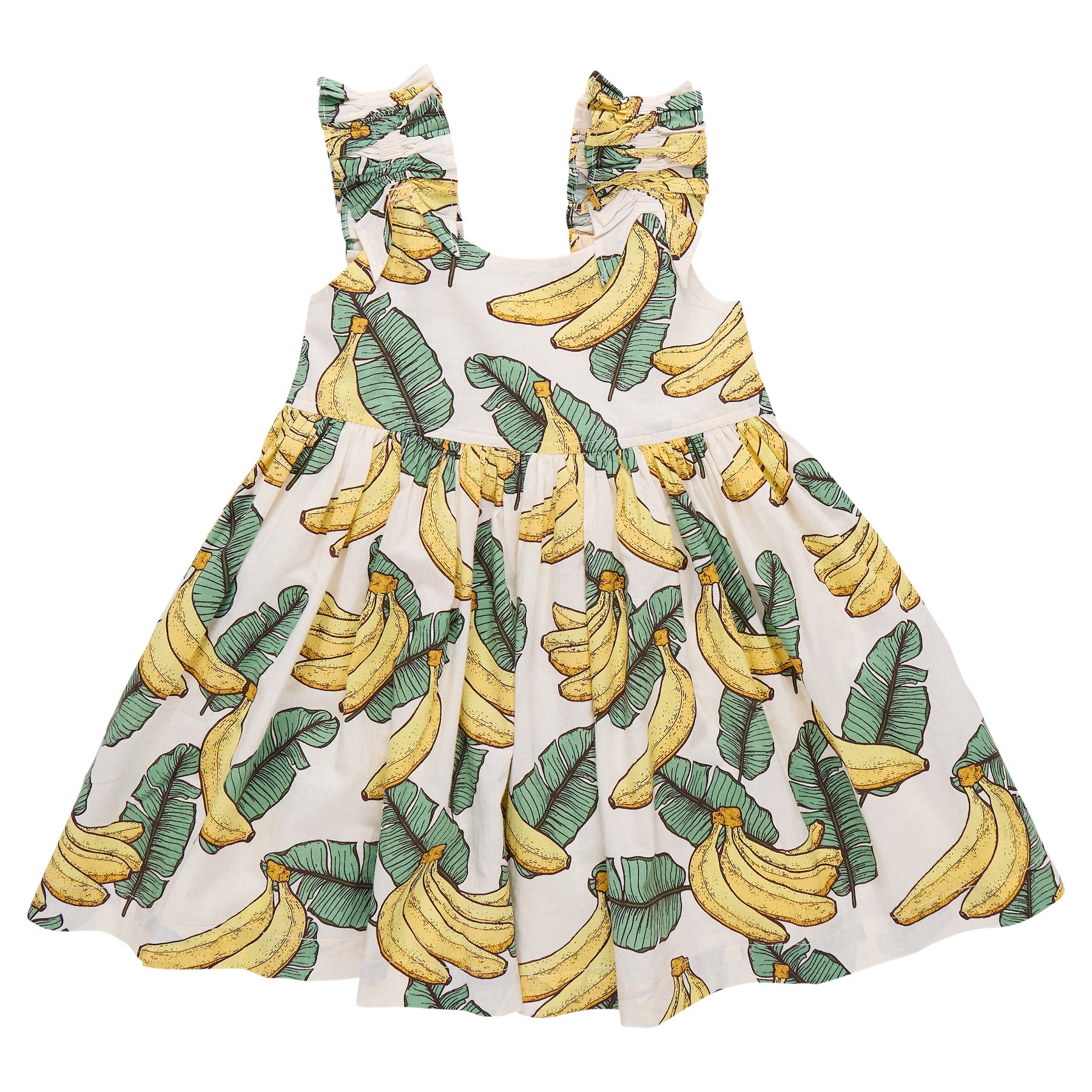The Girls' Via Dress by Pink Chicken is a white sleeveless cotton cambric dress with ruffled, adjustable straps and a playful tropical banana and green leaf print.