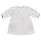 The Pink Chicken Girls' Ava Dress features soft cotton gauze, a gathered neckline, dark cuff trim, and green embroidery. Shown laid flat on a white background.